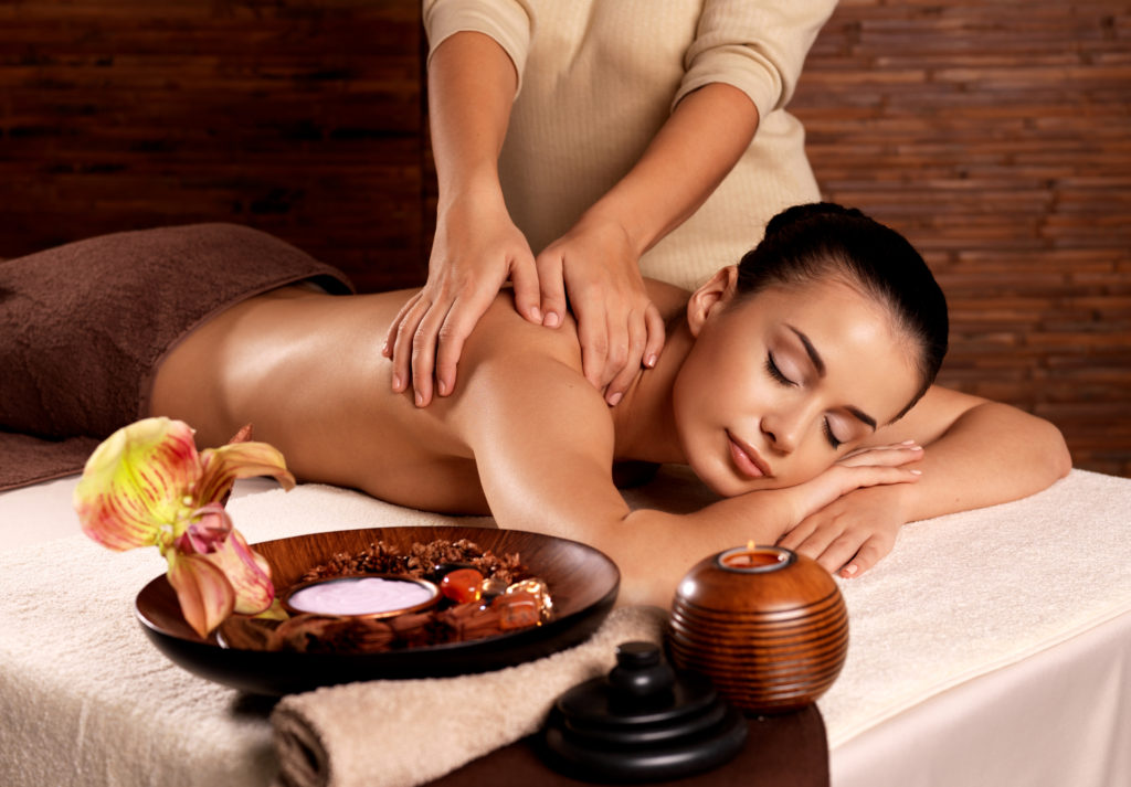 Close-up of aromatic spa oils and candles